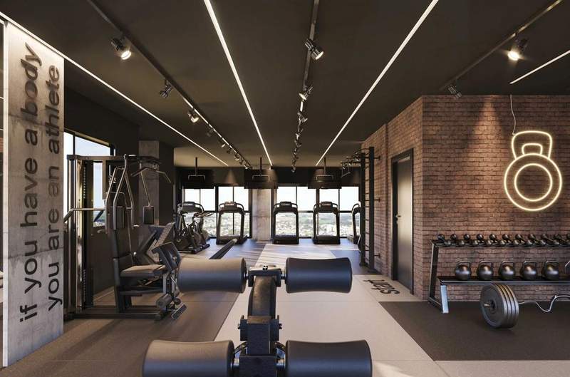 Espaço fitness de empreendimento com estilo industrial
